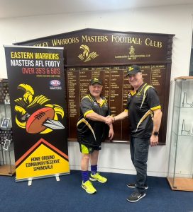 Gary Wilson, newly appointed coaching director, shaking hands with Mark Barber, President of the Eastern Warriors