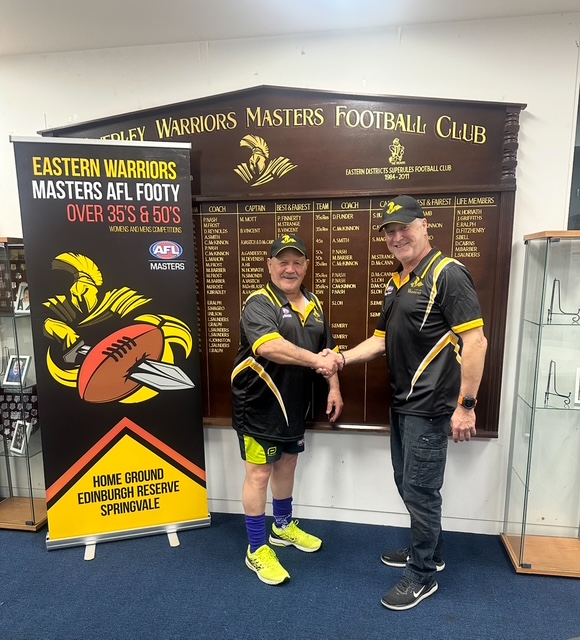 Gary Wilson, newly appointed coaching director, shaking hands with Mark Barber, President of the Eastern Warriors